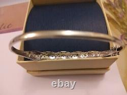 Ladies 9ct white gold hinged bangle/ bracelet with tiny chip diamonds pre owned