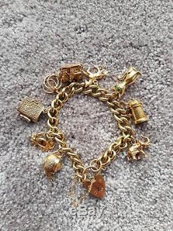 OUTSTANDING VINTAGE 9ct GOLD CHARM BRACELET 61 grams (very heavy)