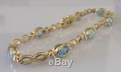 Secondhand 9ct yellow gold multi oval blue topaz round diamond bracelet 7inches