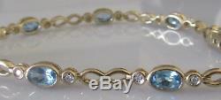 Secondhand 9ct yellow gold multi oval blue topaz round diamond bracelet 7inches