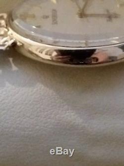 Sovereign 9ct gold men's watch with a 9ct gold bracelet in excelent condition