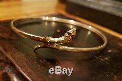 VINTAGE 9ct GOLD SNAKE BANGLE. WITH GARNET EYES EXCELLENT CONDITION