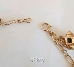 Vintage 9ct Yellow gold bracelet. Suspended from which are Eight 9ct charms