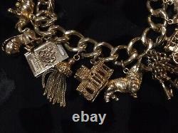 Vintage 9ct gold charm bracelet with 14 charms And Valuation 103.60g