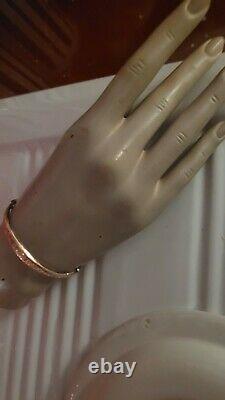 Vintage 9ct rose gold hollow bangle with ornate pattern