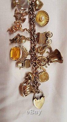 Vintage Gold 9ct charm bracelet with 25 charms