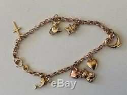Vintage solid 9ct gold charm bracelet with 8 charms Hallmarked 9KT